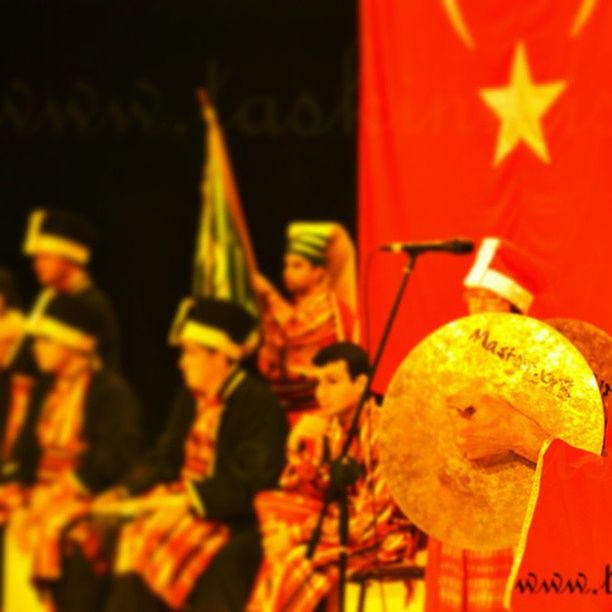 illuminated, close-up, religion, focus on foreground, indoors, celebration, spirituality, tradition, night, cultures, candle, lantern, flame, yellow, human representation, selective focus, decoration, red, place of worship, art and craft