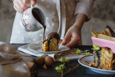 Midsection of woman preparing food on table