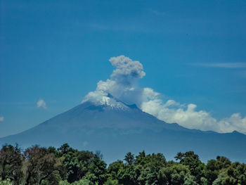 Scenic view of volcanic mountain against sky