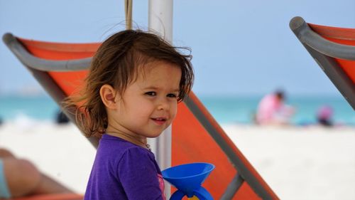 Close-up of cute girl at beach