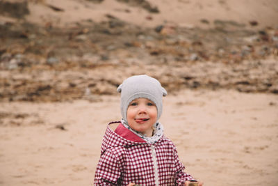 Portrait of girl standing on field