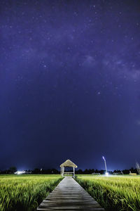 Scenic view of field against sky at night