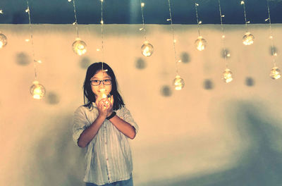 Portrait of a smiling young woman in bubbles