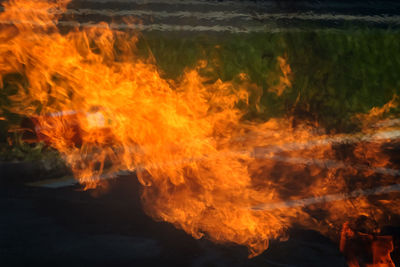 Close-up of fire burning on land
