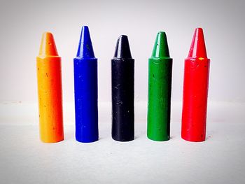 Close-up of colorful pencils on white background