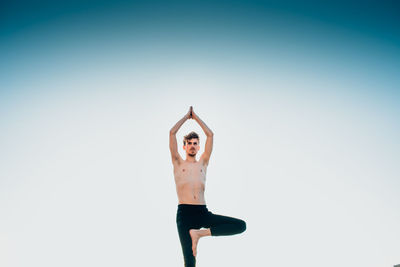 Full length of man standing against sky