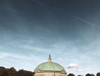 Low angle view of a building against cloudy sky