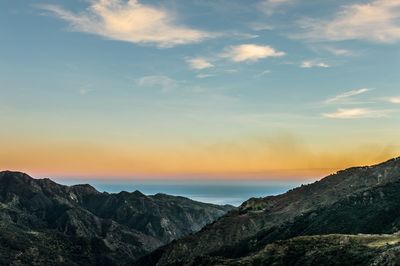 Scenic view of mountains against sky during sunset