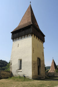 Low angle view of old building against clear sky