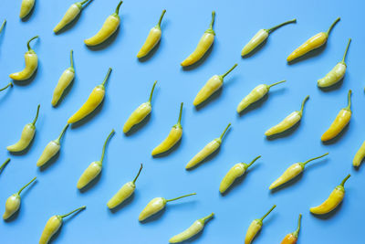 High angle view of chopped yellow against blue background