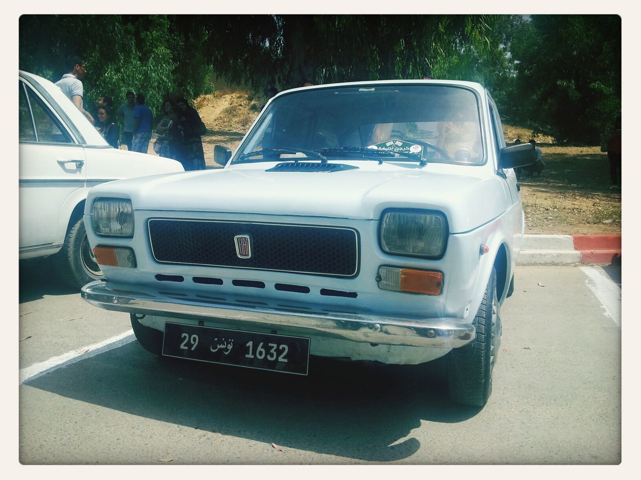 transfer print, transportation, mode of transport, land vehicle, car, auto post production filter, road, street, travel, tree, day, outdoors, no people, vehicle, sunlight, close-up, on the move, stationary, part of, parked