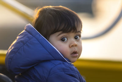 Portrait of cute boy looking away