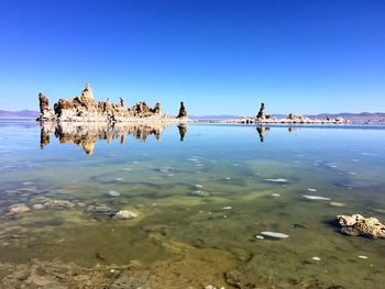 Scenic shot of calm lake with rock formations