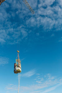 Low angle view of communications tower against sky