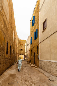 Rear view of man on house