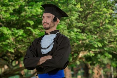 Portrait of young man standing outdoors