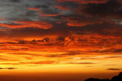 Scenic view of dramatic sky during sunset