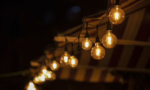 Low angle view of illuminated light bulb