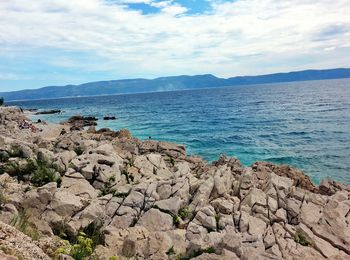 Scenic view of sea against cloudy sky