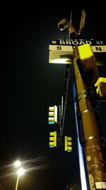 Low angle view of illuminated lights at night