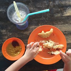 Cropped image of woman eating food