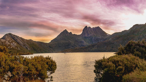 Scenic view of lake and mountains against sky