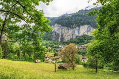 View of lauterbrunnen village and staubbach waterfall. 