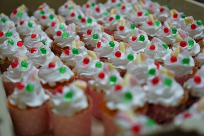 Close-up of cupcakes fancy on table against white background