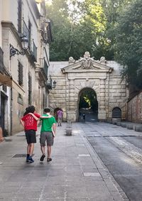 People walking in front of building