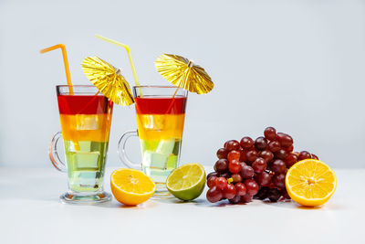 Fruits on glass with orange juice