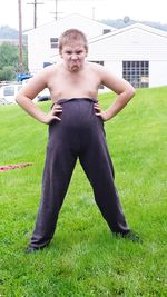 Full length of woman standing on grassy field