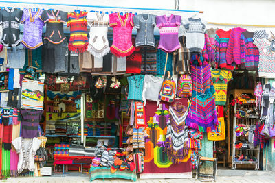 Warm clothes hanging outside store at witches market