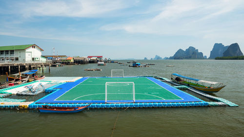 Floating football or soccer field at panyee island with float village, phang nga bay, thailand. 