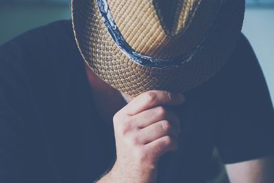 Close-up of man wearing hat