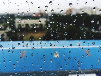 Full frame shot of raindrops on glass window