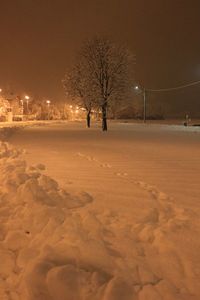 Snow covered landscape at night