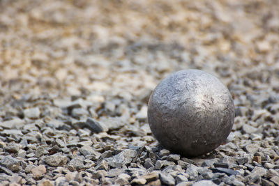 Close-up of stone ball on rock