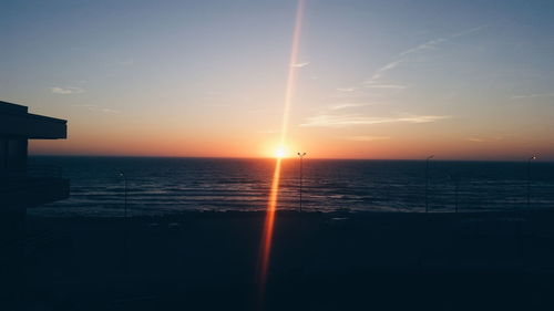 Scenic view of calm sea at sunset