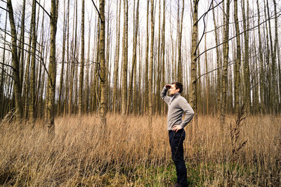 Man standing in forest