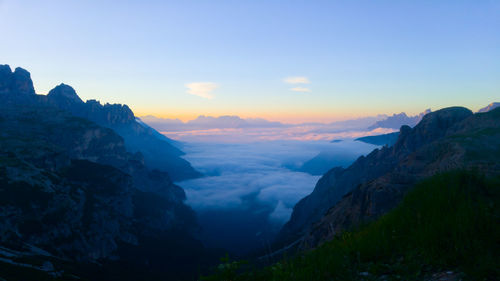 Scenic view of mountains against sky during sunset