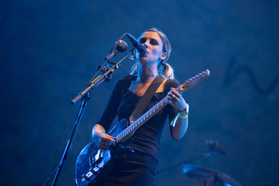 Woman playing guitar