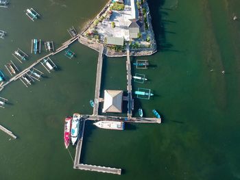 High angle view of sailboats moored in river