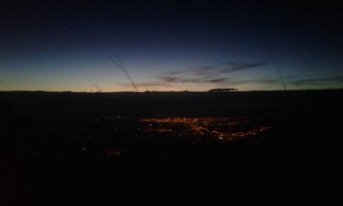 Silhouette landscape against sky during sunset