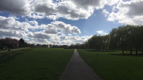 Panoramic view of green landscape against sky