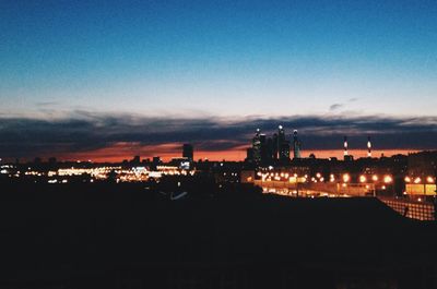 Illuminated cityscape at night