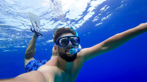 Portrait of man swimming in sea