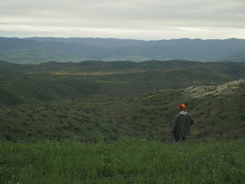 Man standing on grassy field