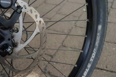 High angle view of bicycle wheel on street