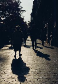 Woman walking on footpath