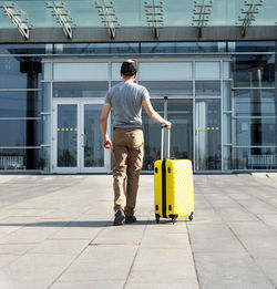 Rear view of man walking on street